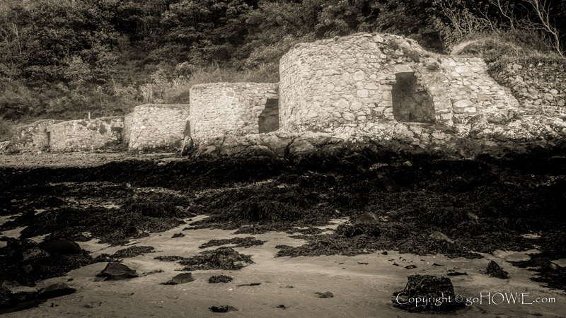Decaying lime kilns on the shoreline at Solva harbour in the Pembrokeshire National Park, Wales