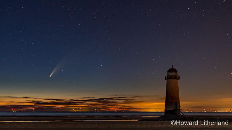 Comet Neowise over Point of Ayr lighthouse at midnight, North Wales