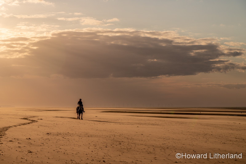 Horse and rider at Talacre beach on the North Wales coast