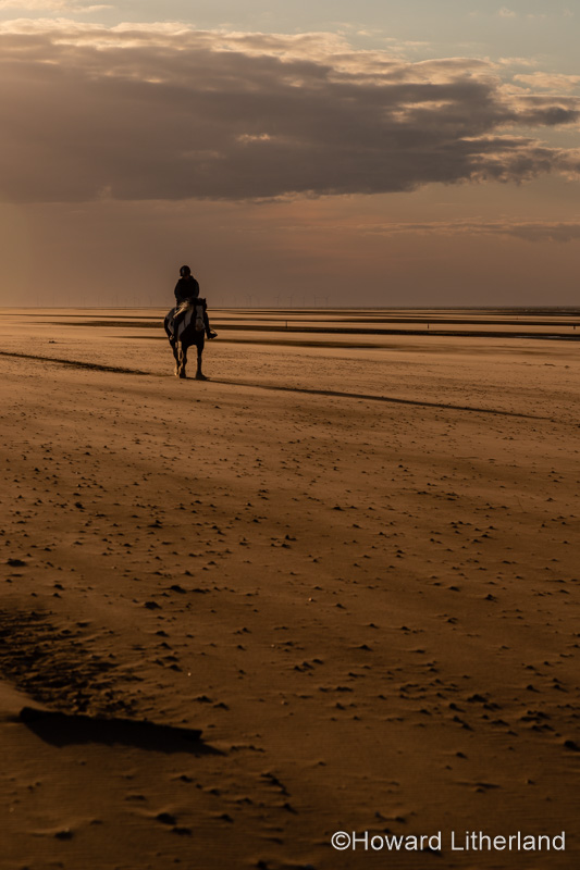 Horse and rider at Talacre beach on the North Wales coast
