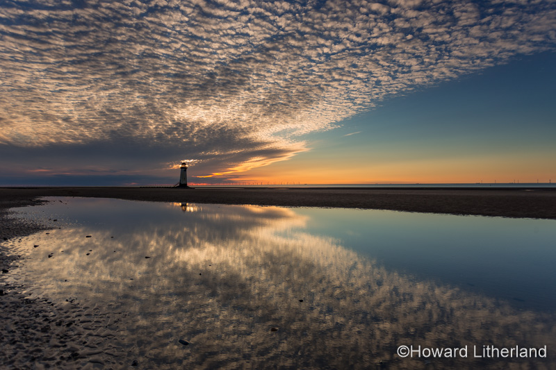 Point of Ayr lighthouse on Talacre beach at dusk, North Wales coast