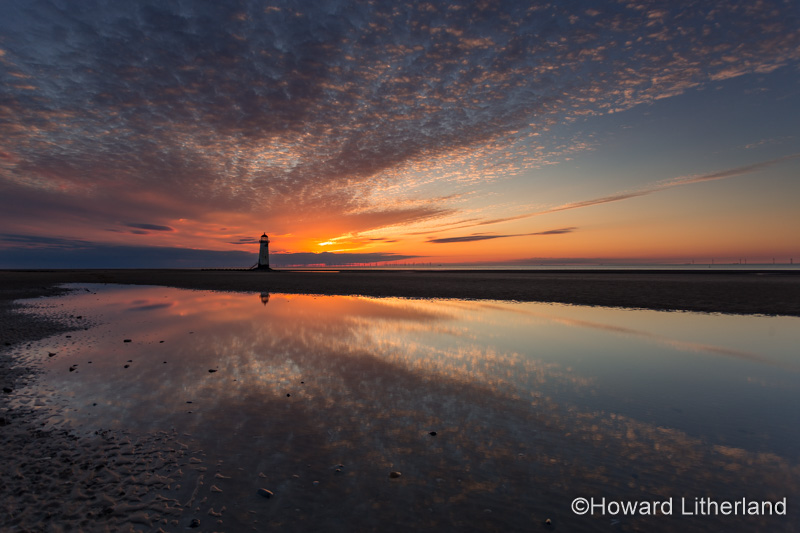 Point of Ayr lighthouse on Talacre beach at dusk, North Wales coast