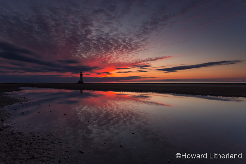Point of Ayr lighthouse on Talacre beach at dusk, North Wales coast