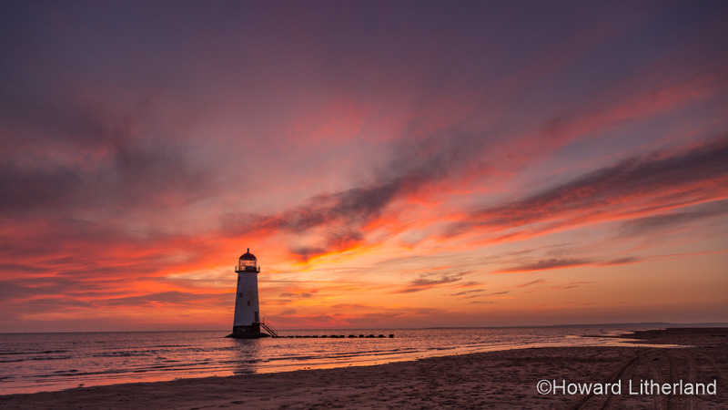 Point of Ayr lighthouse on Talacre beach at sunrise, North Wales coast