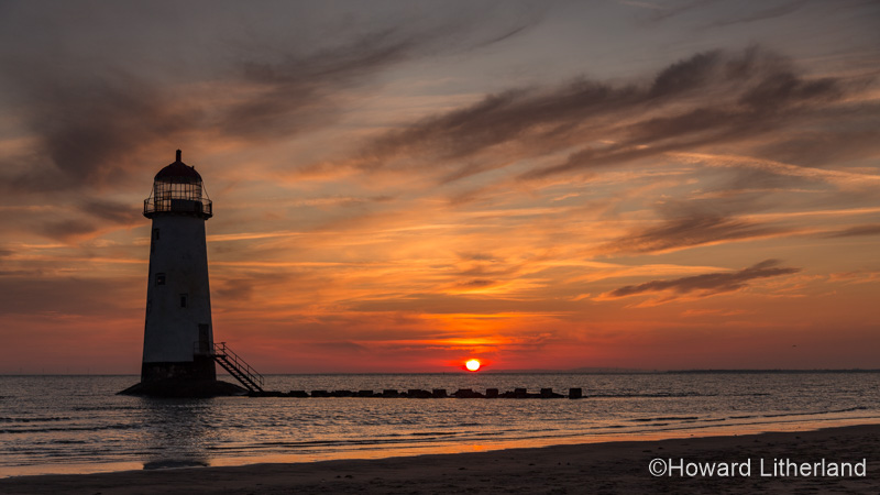 Point of Ayr lighthouse on Talacre beach at sunrise, North Wales coast