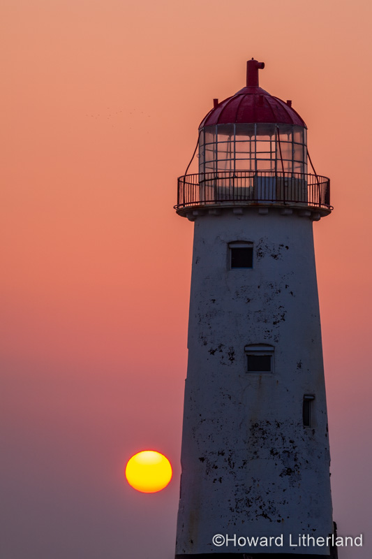 Point of Ayr lighthouse at sunset, Talacre, North Wales