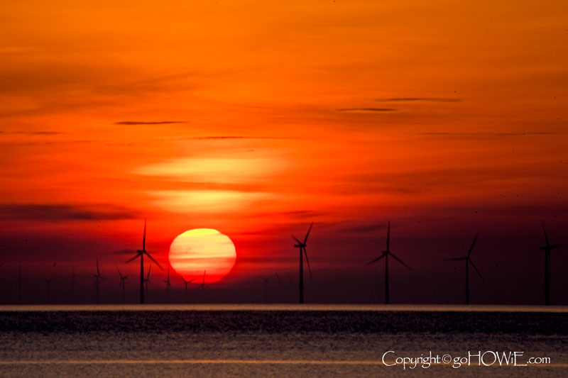 Colwyn Bay wind farm at sunrise, viewed from Llandudno on the North Wales coast