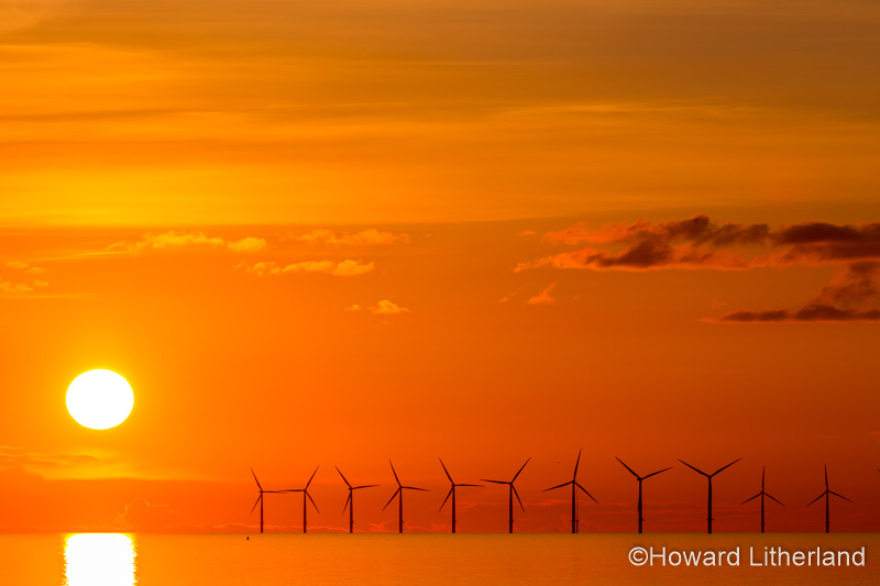 Sunset over the Gwynt y Mor windfarm from Rhyl on the North Wales coast